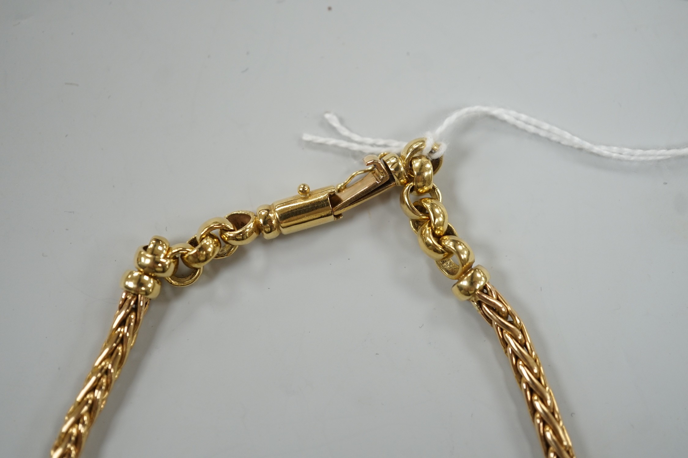 A modern continental yellow metal, single and twin strand interwoven link necklace, approximately 40cm, 44.6 grams.